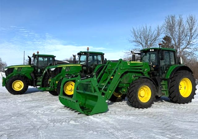 Line up of 3 john deere